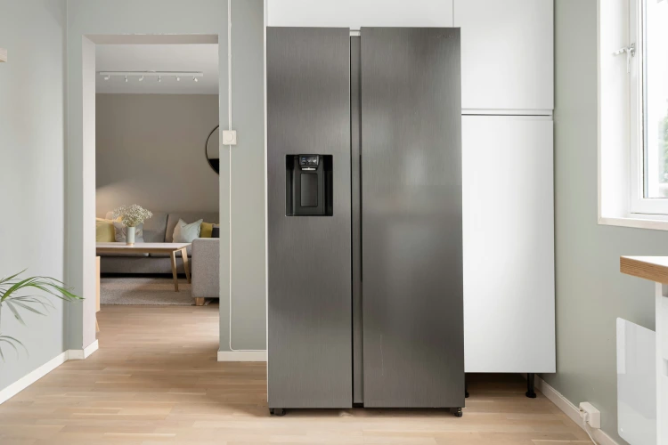 Refrigerator Repair Westminster technician servicing a refrigerator in a Westminster, CO home